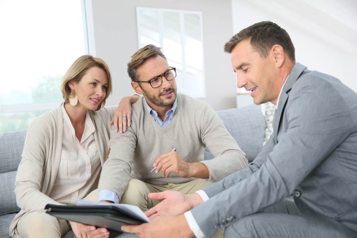 Couple signing mortgage contract