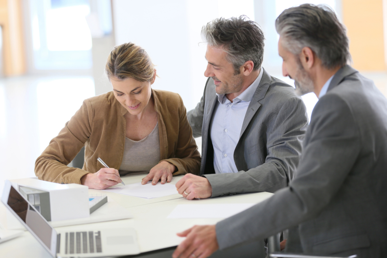 Couple signing construction contract